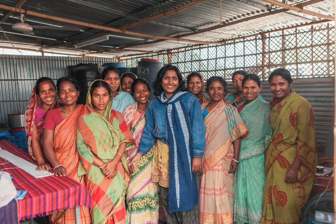 services-03 Group of women in colorful sarees working in a cooperative, Bangladesh.